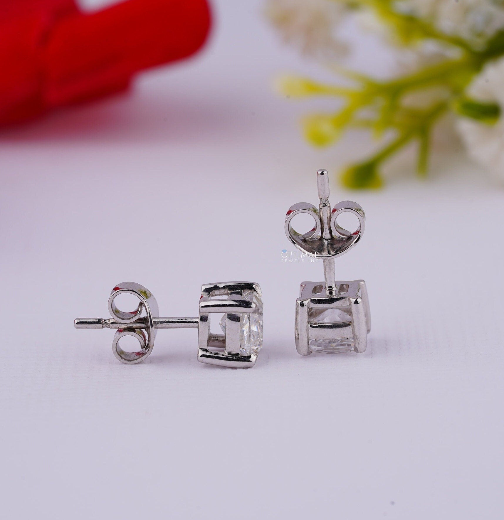 Cushion Cut Diamond Stud Earrings in white gold featuring lab-grown diamonds, elegantly designed for engagement or gifting.