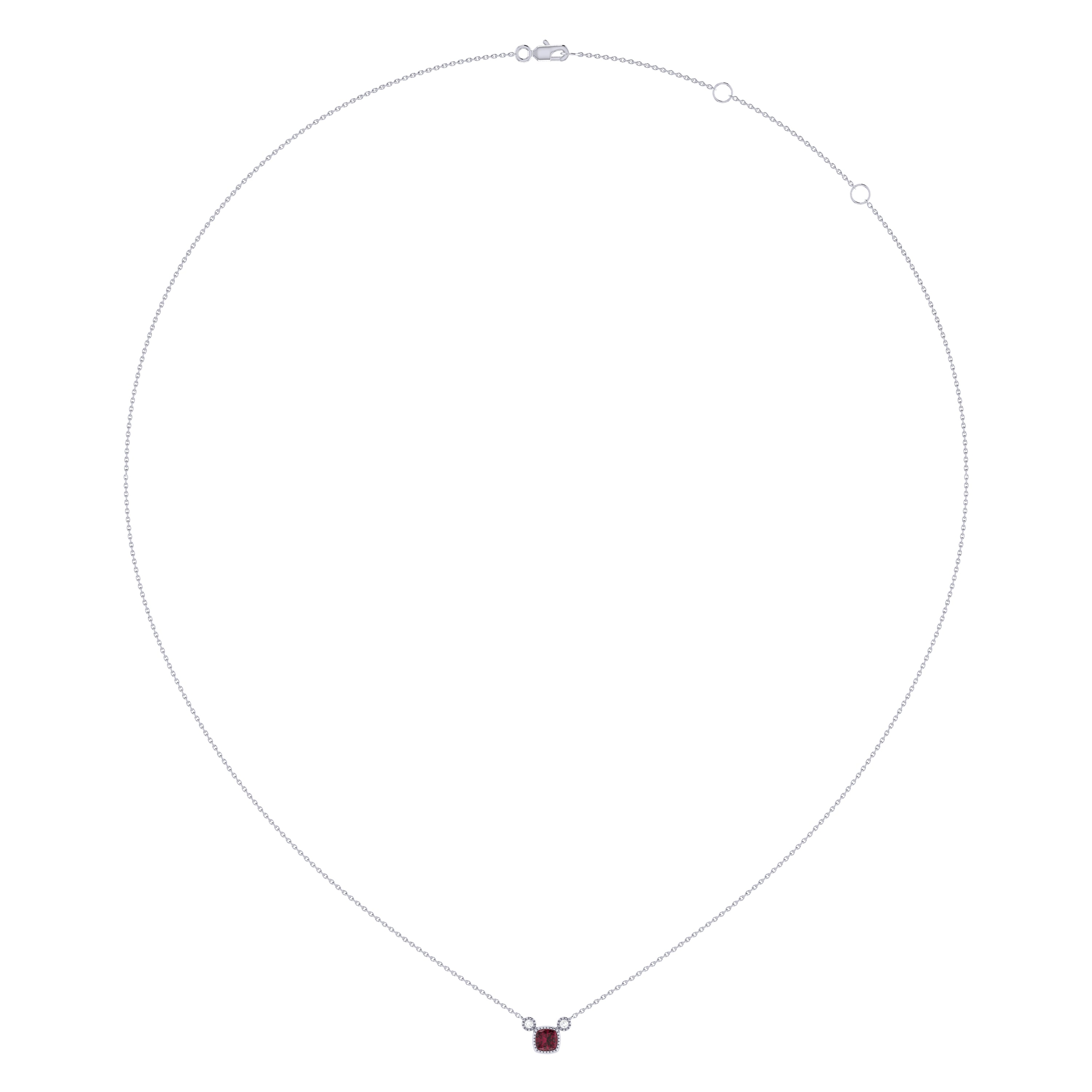 Cushion Cut Ruby & Diamond Birthstone Necklace in 14K White Gold with adjustable chain and bezel setting.