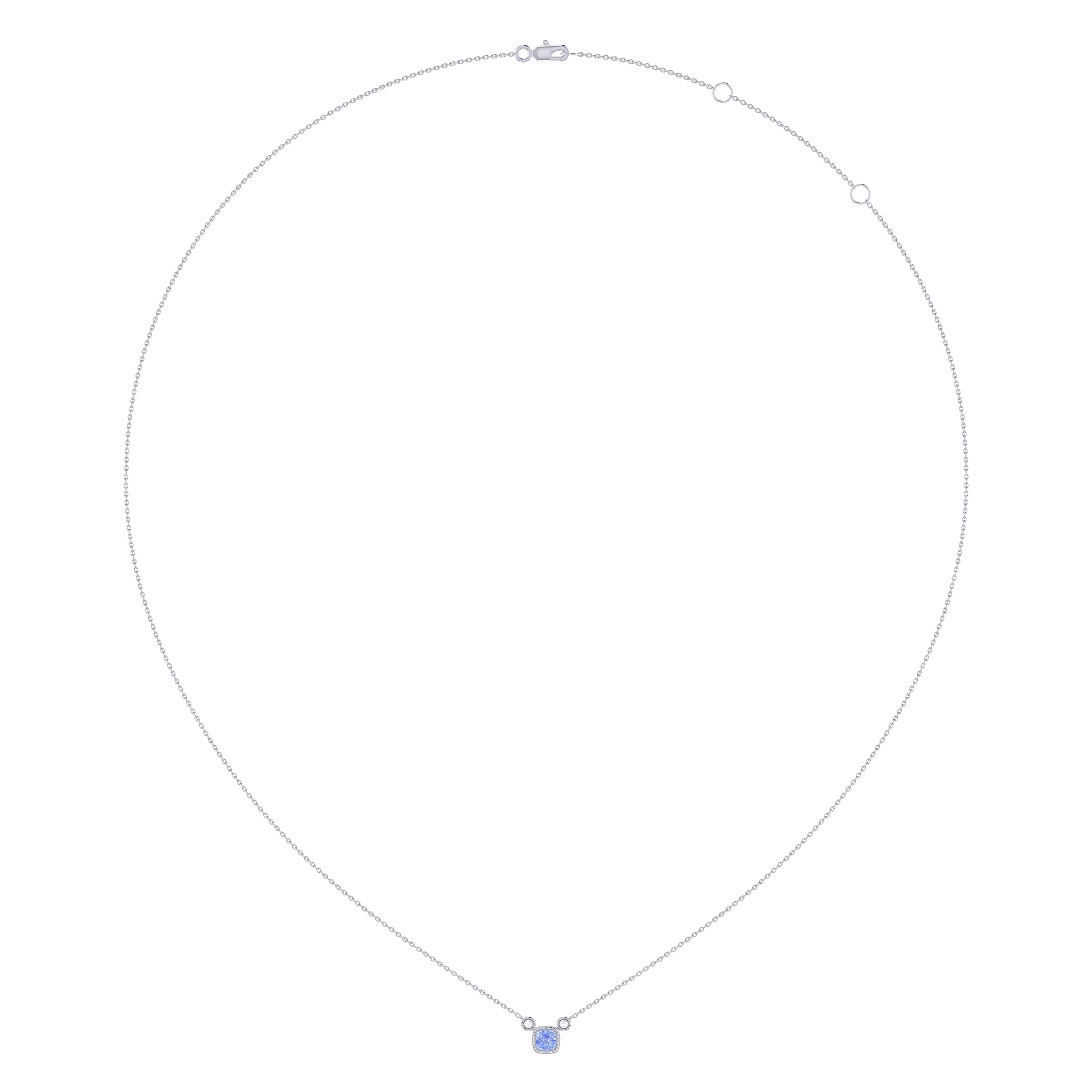 Cushion Cut Tanzanite and Diamond Birthstone Necklace in 14K White Gold, featuring a vibrant tanzanite gemstone and sparkling diamonds on a delicate chain.