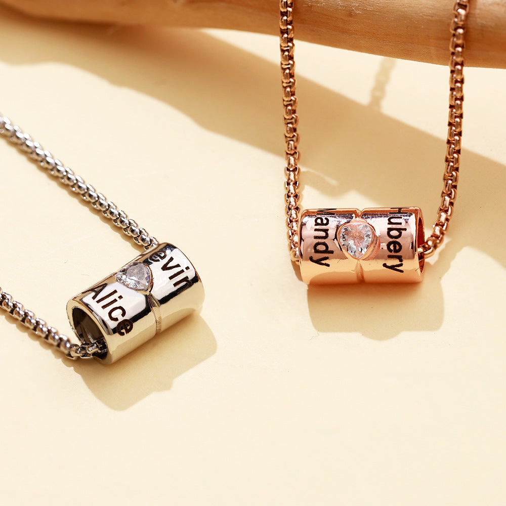 Custom Name Cylinder Pendant Necklace made of stainless steel, featuring a personalized name engraving, adjustable length, and elegant design.