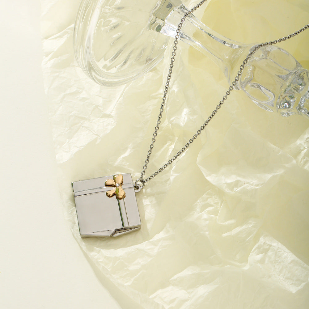 Custom Name Gift Box Necklace made of stainless steel, featuring a personalized name pendant, elegantly displayed in a gift box.