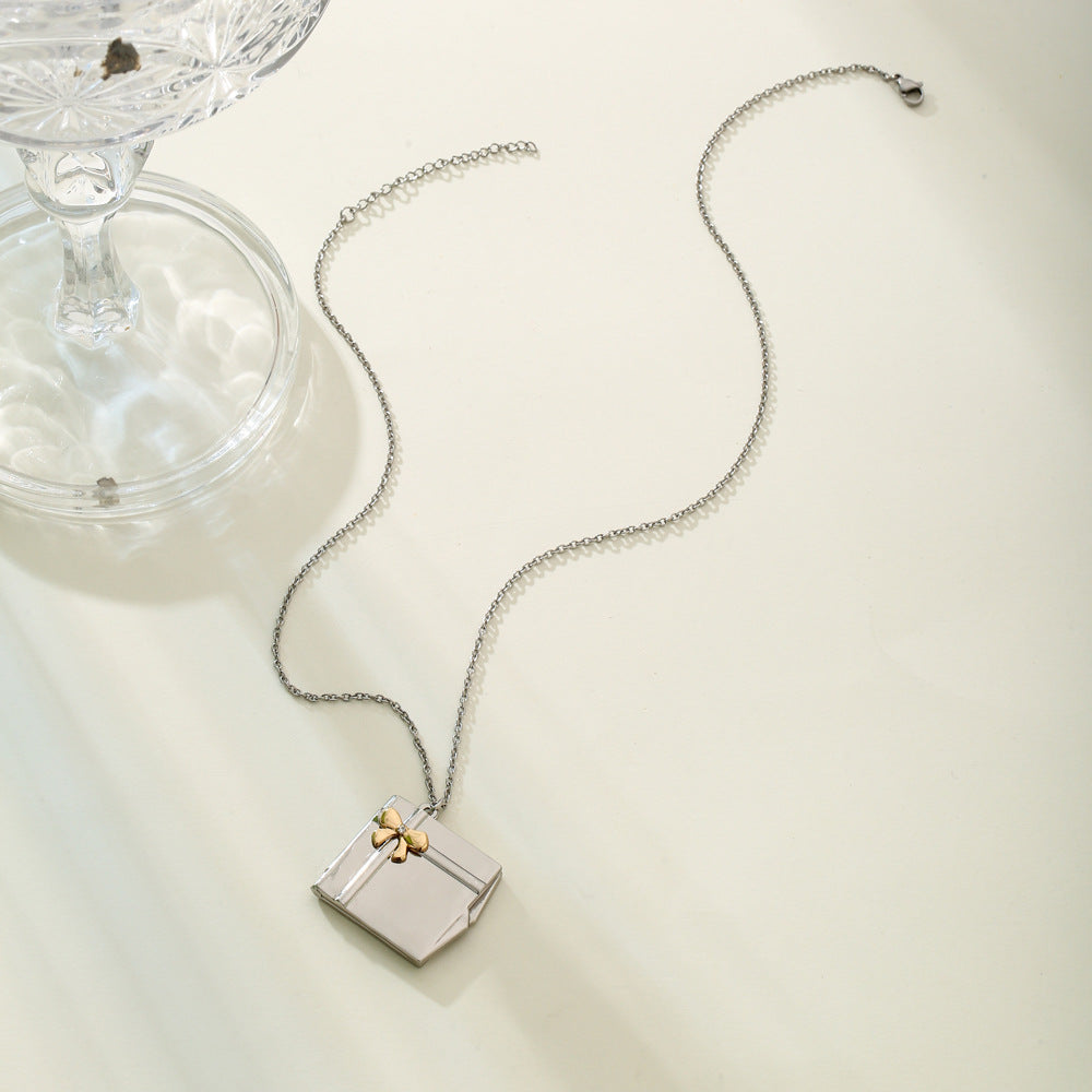 Custom Name Gift Box Necklace made of stainless steel, featuring a personalized name pendant, elegantly displayed in a gift box.