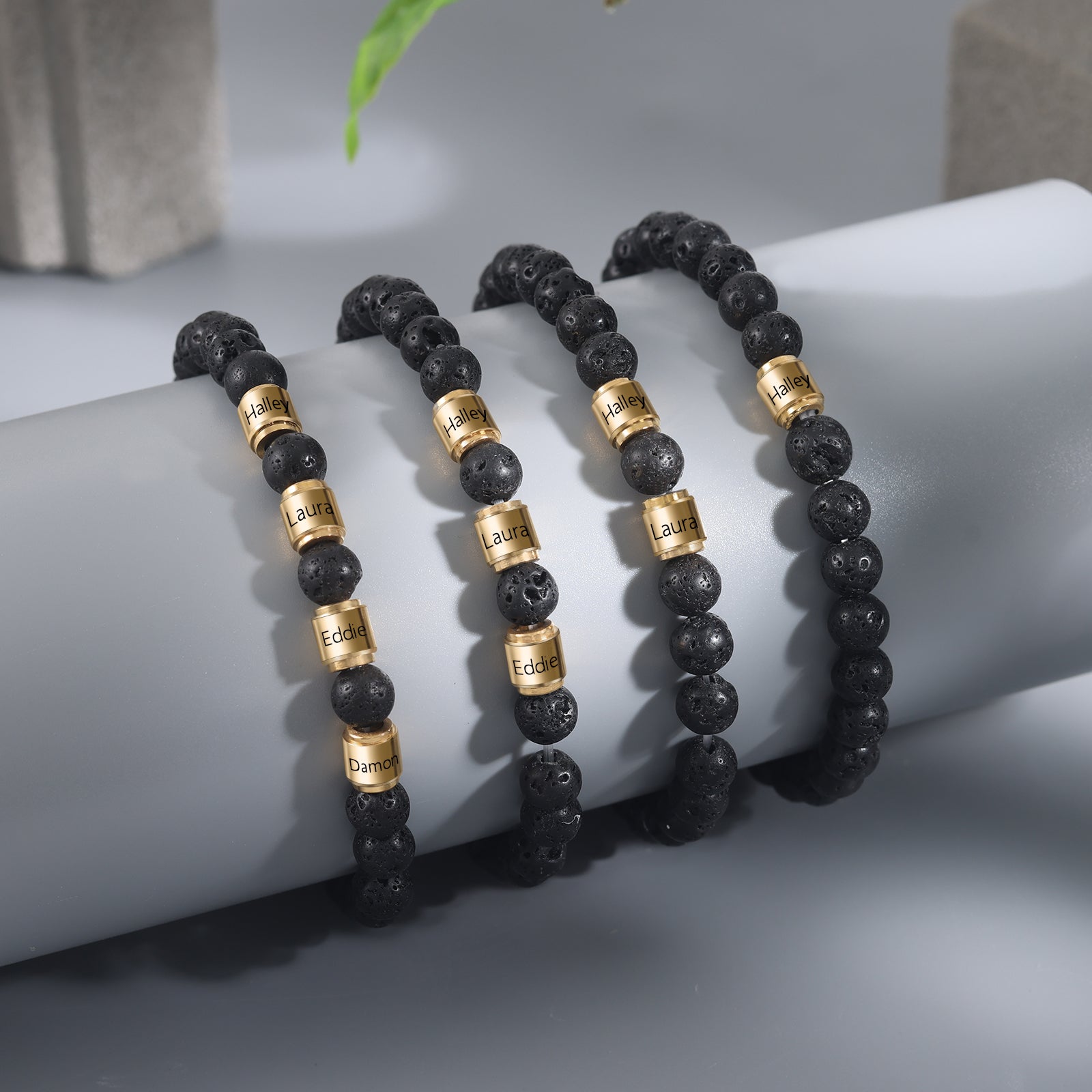 Custom Name Stainless Steel Volcanic Stone Bracelet featuring gold plating and black volcanic stone, personalized with name engraving.