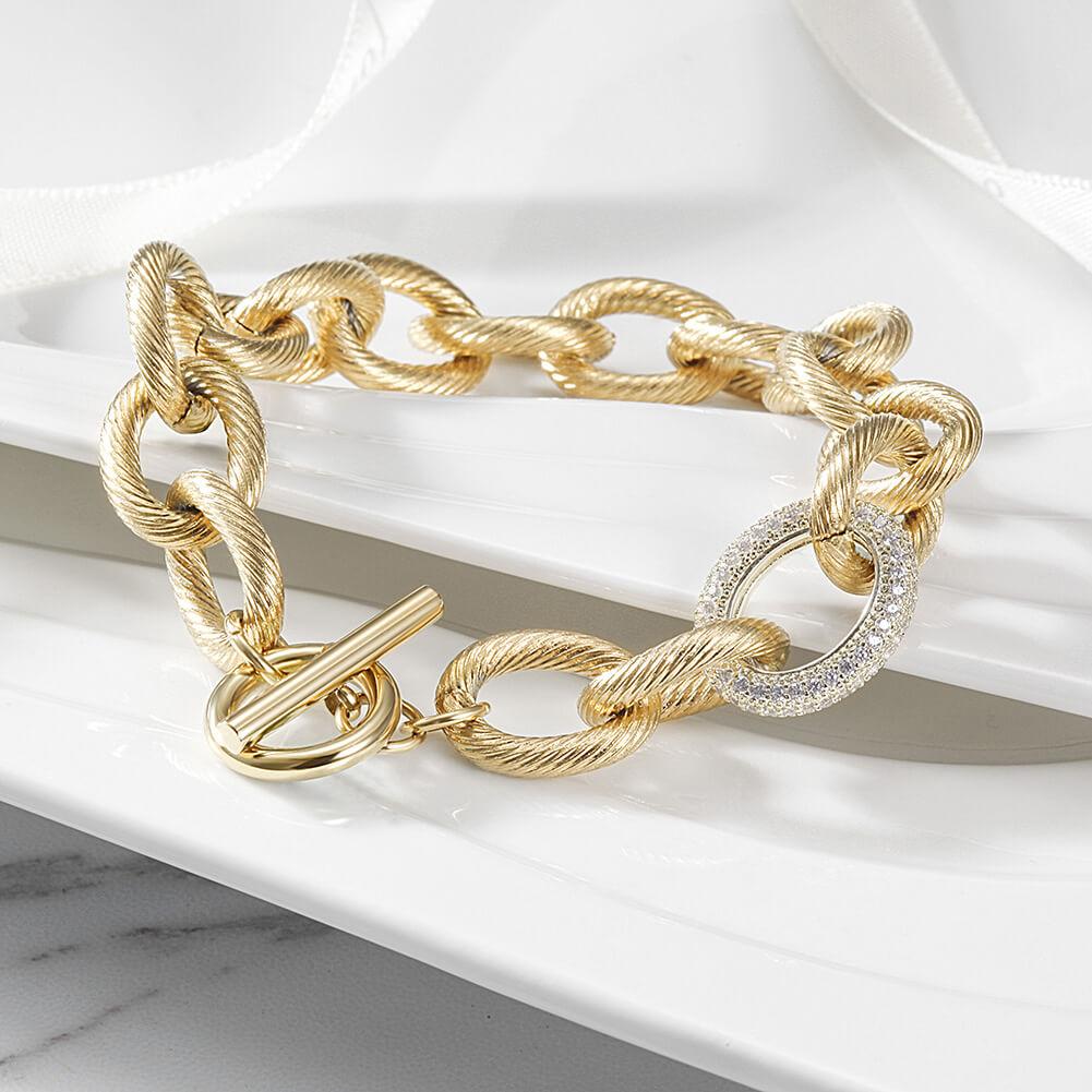 CZ Twisted Wire Link Bracelet made of 316L surgical stainless steel with 14K gold PVD plating, showcasing its elegant twisted design.