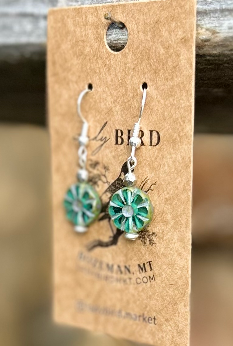 Czech Glass Bronzed Aquamarine Flower Window Coin Earrings featuring translucent aquamarine glass with floral design and metallic accents.