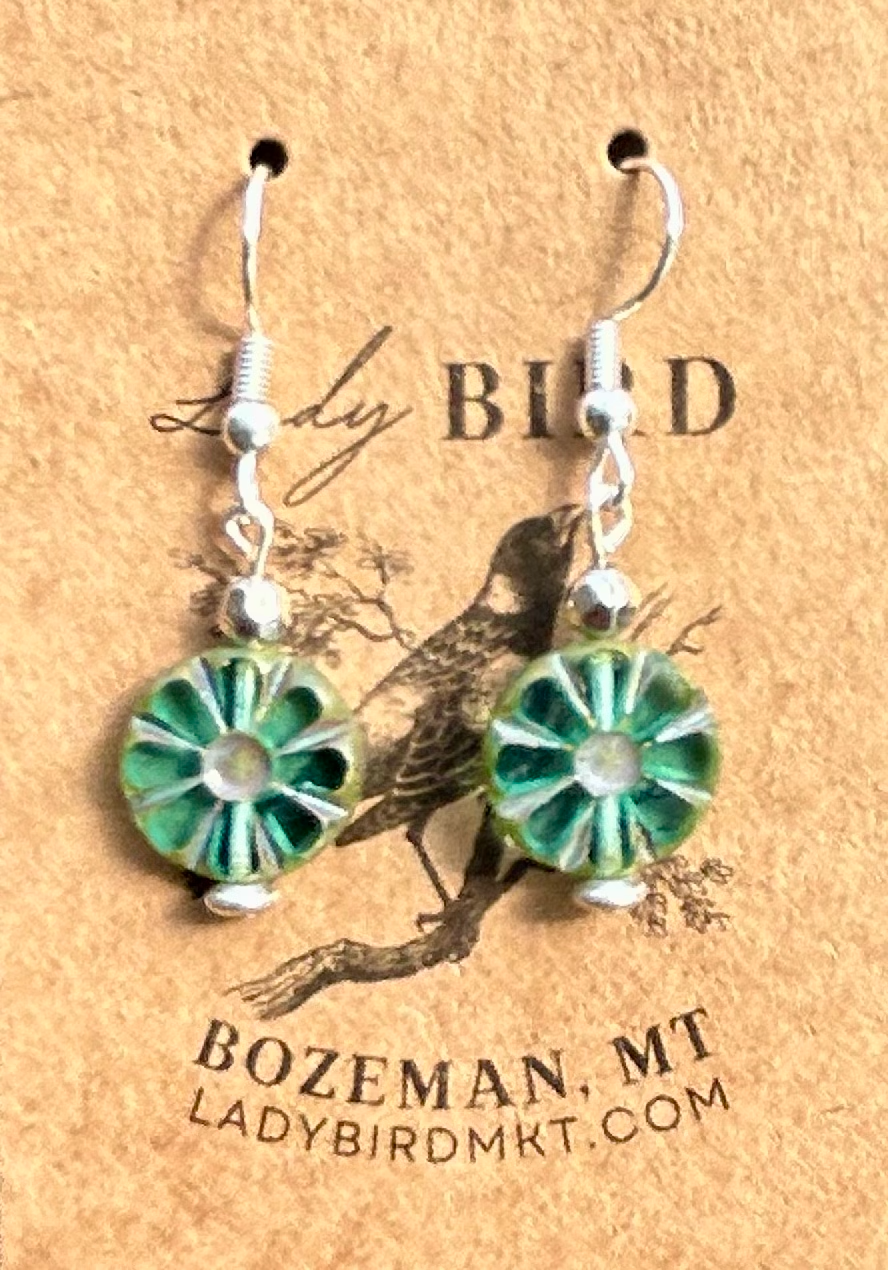 Czech Glass Bronzed Aquamarine Flower Window Coin Earrings featuring translucent aquamarine glass with floral design and metallic accents.