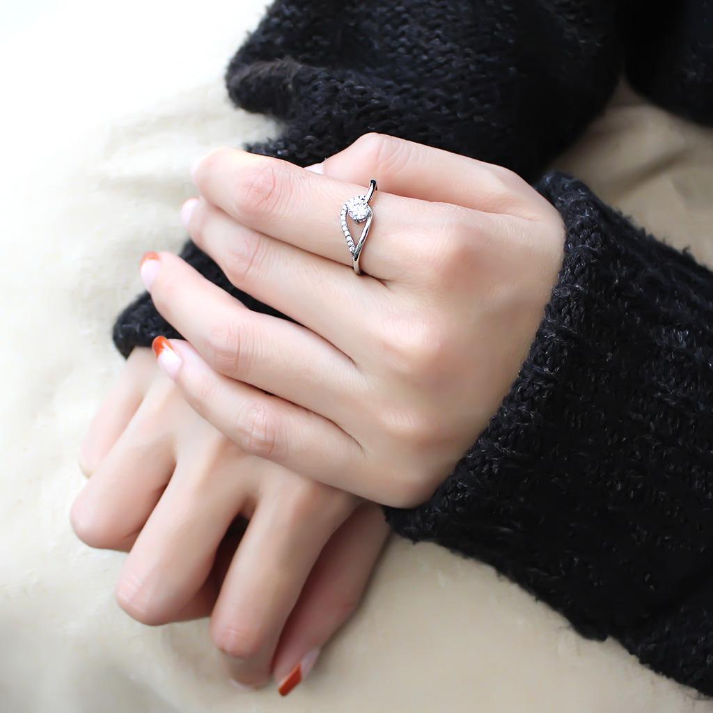 DA105 High Polished Stainless Steel Ring featuring a clear AAA Grade CZ center stone, showcasing its elegant design and shine.