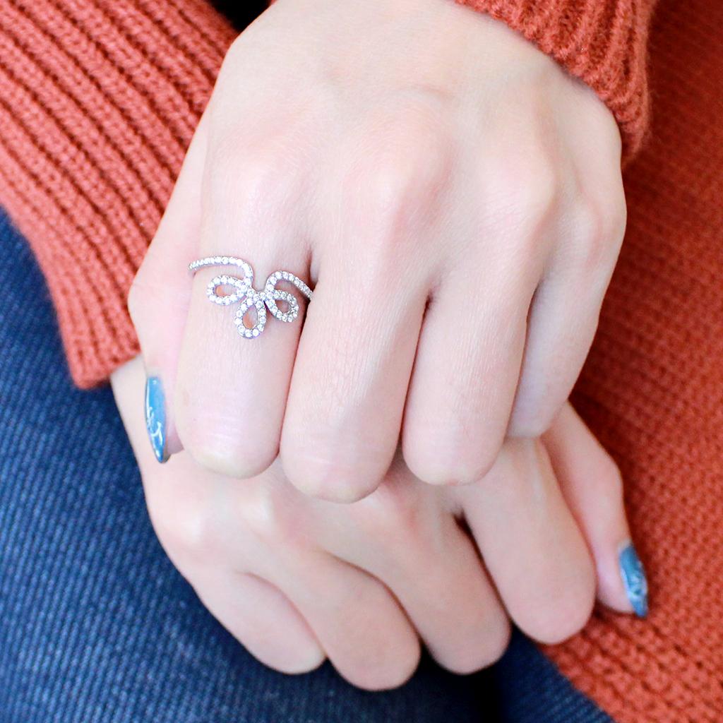 DA141 High Polished Stainless Steel Ring featuring a clear AAA Grade CZ center stone, showcasing its elegant design and shiny finish.