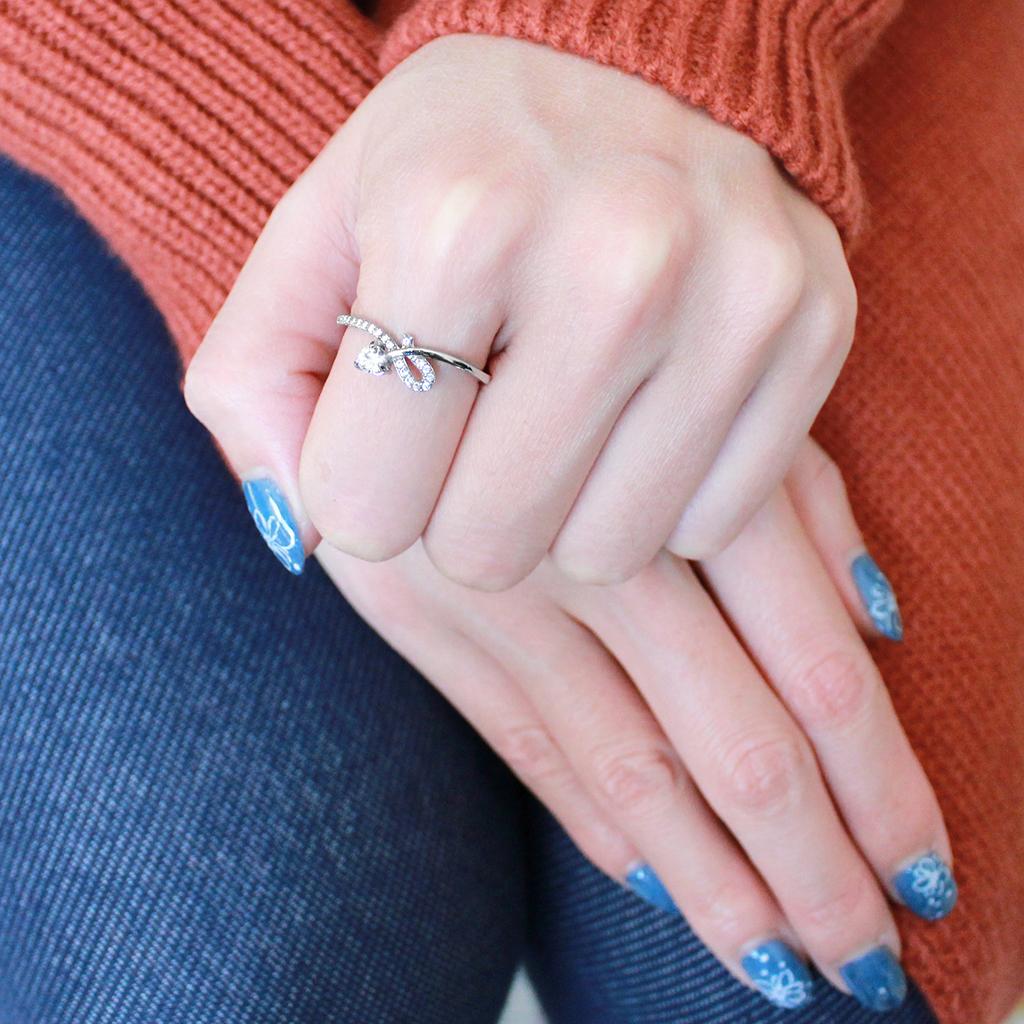 DA142 High Polished Stainless Steel Ring featuring a clear AAA Grade CZ center stone, showcasing its elegant design and shine.