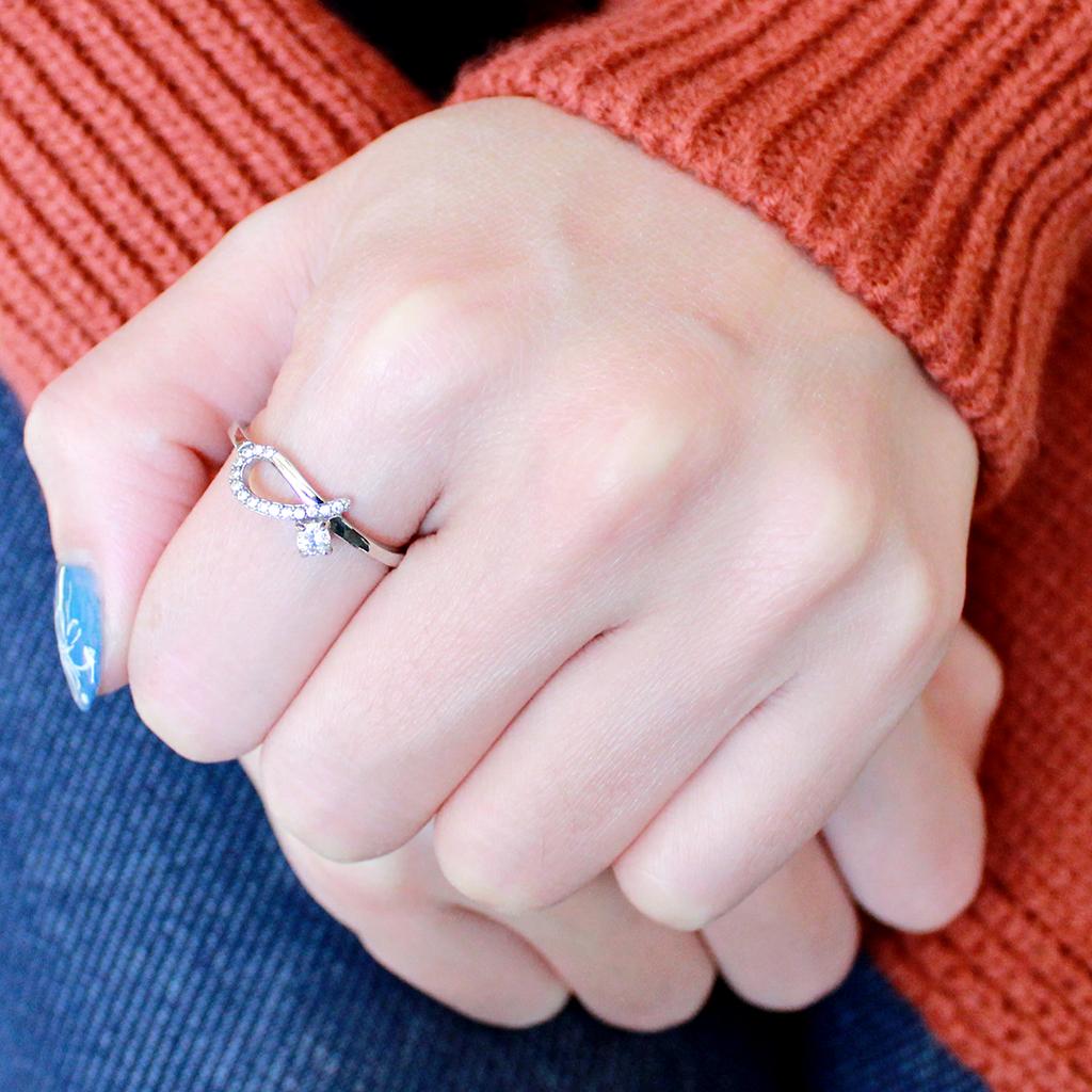 DA143 High Polished Stainless Steel Ring featuring AAA Grade clear CZ center stone, showcasing its elegant design and shine.