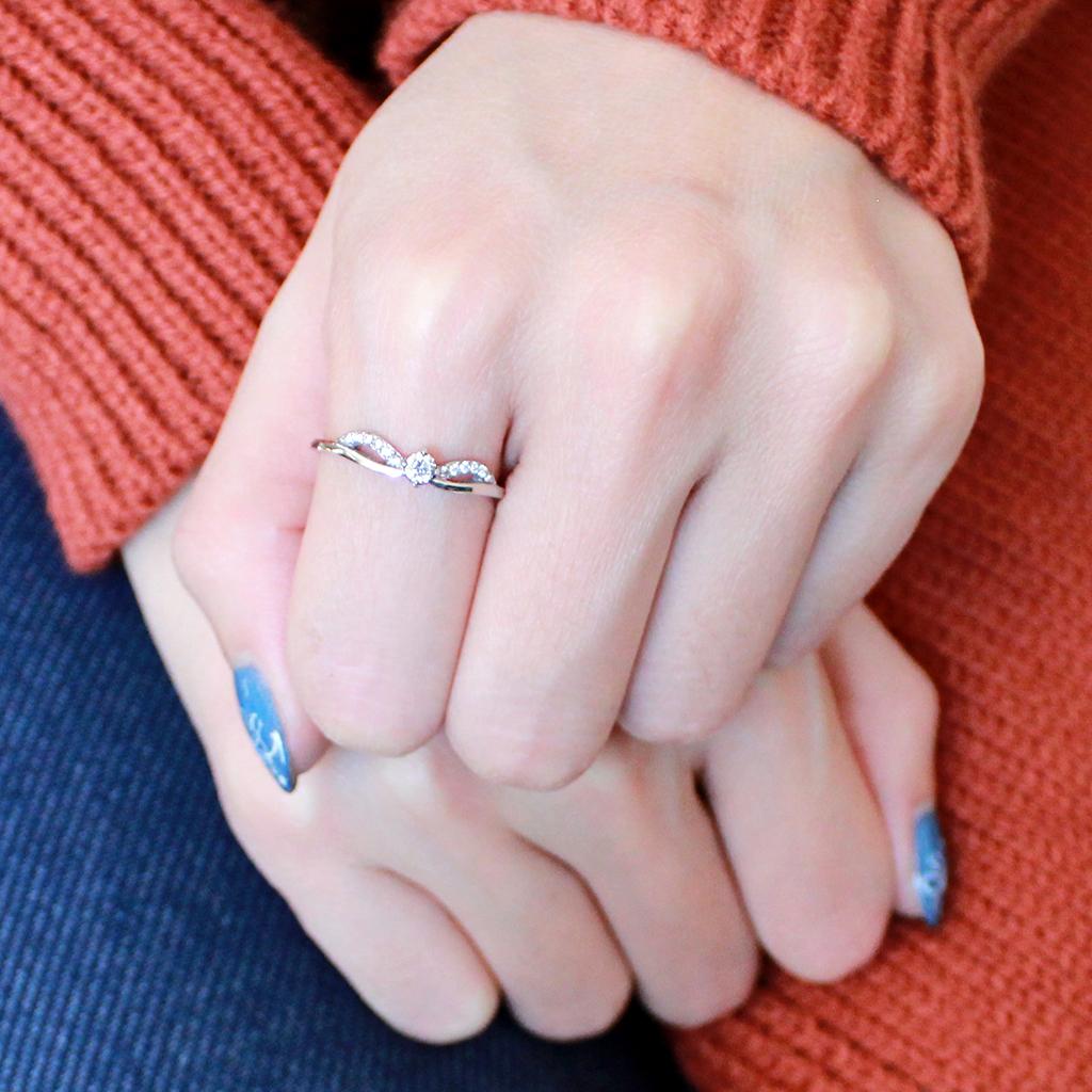 DA146 High Polished Stainless Steel Ring featuring a clear AAA Grade CZ center stone, showcasing its elegant design and shiny finish.