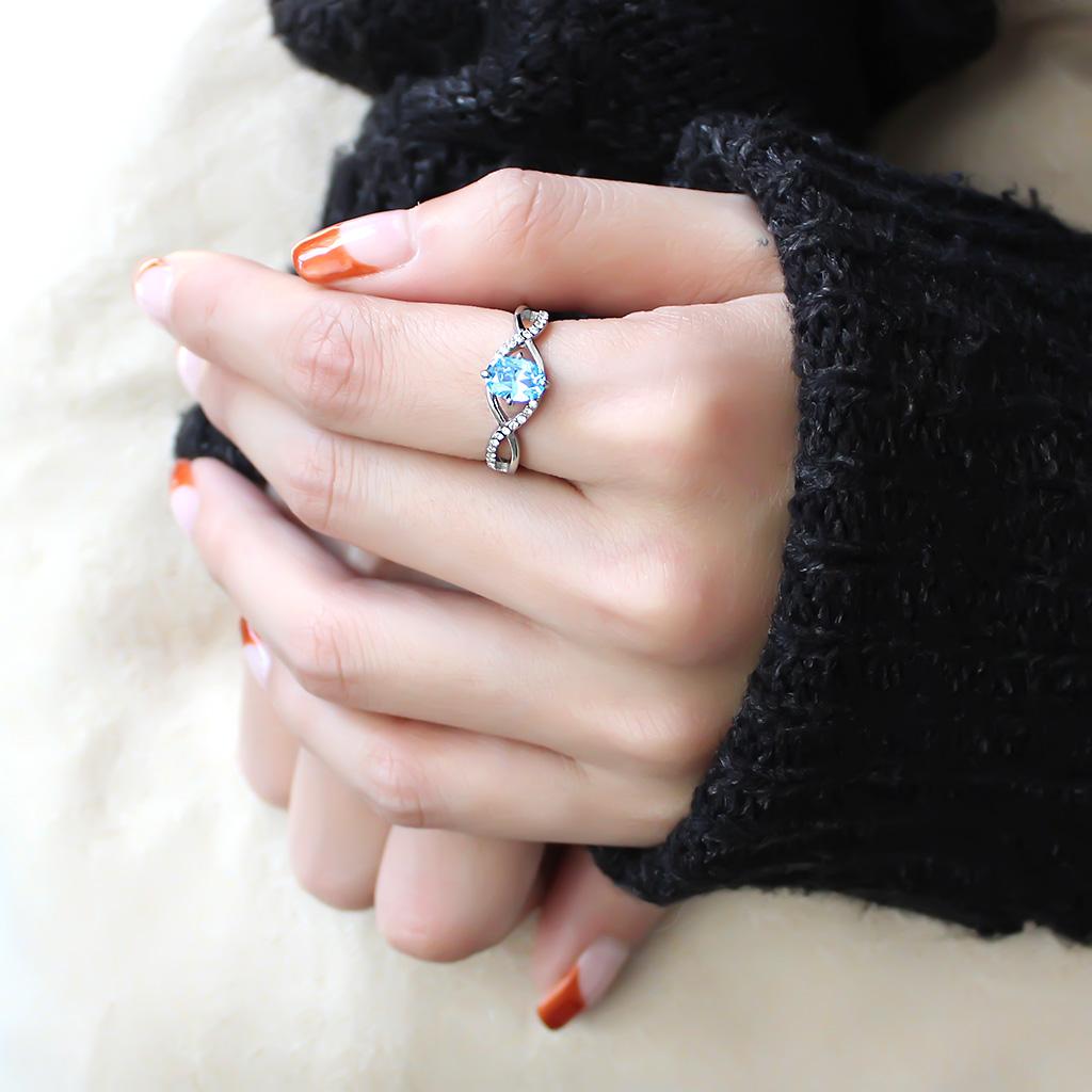 DA117 High Polished Stainless Steel Ring featuring a AAA Grade Sea Blue CZ stone, showcasing its elegant design and high shine finish.