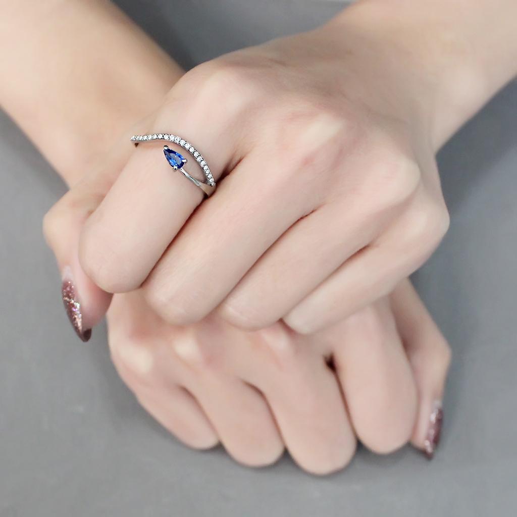 DA273 High Polished Stainless Steel Ring featuring a London Blue Spinel center stone, showcasing its elegant design and polished finish.