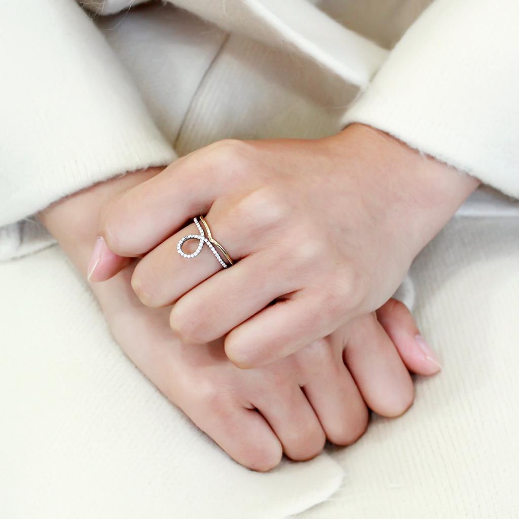 DA278 Two-Tone IP Gold Stainless Steel Ring featuring a clear AAA grade CZ stone, showcasing a luxurious design and elegant finish.