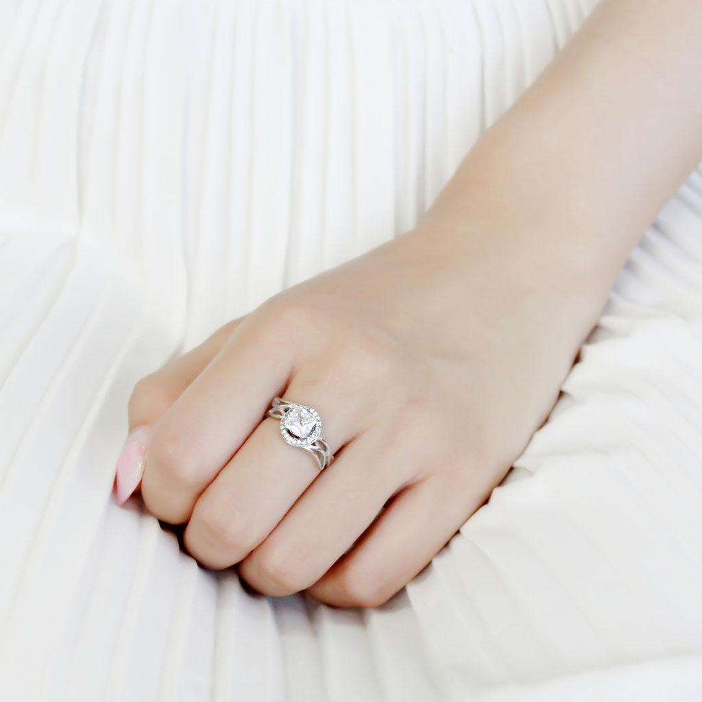 DA357 High Polished Stainless Steel Ring featuring a clear AAA Grade CZ center stone, showcasing its elegant design and shiny finish.