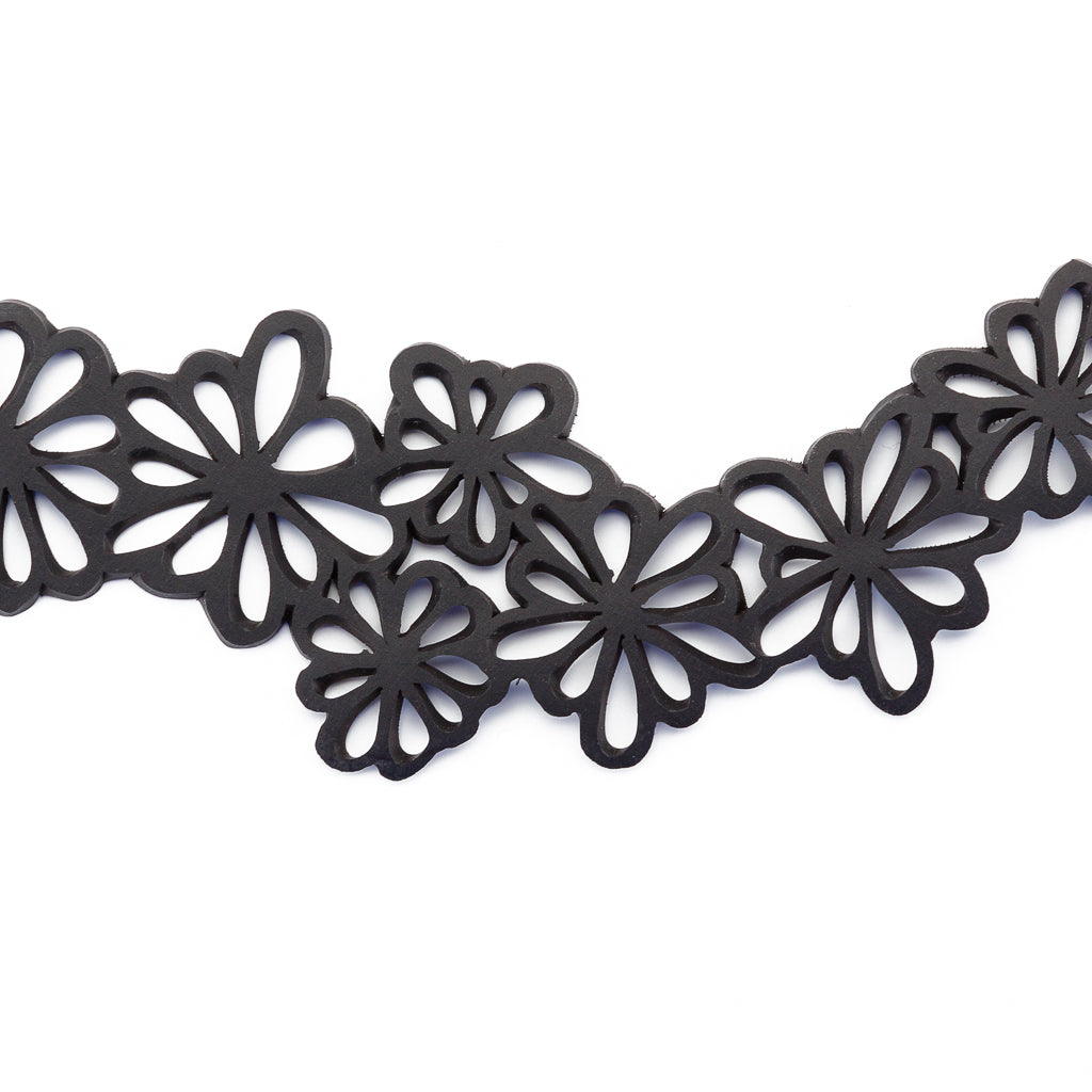 Dahlia Recycled Rubber Statement Flower Choker featuring a unique flower design made from eco-friendly materials.