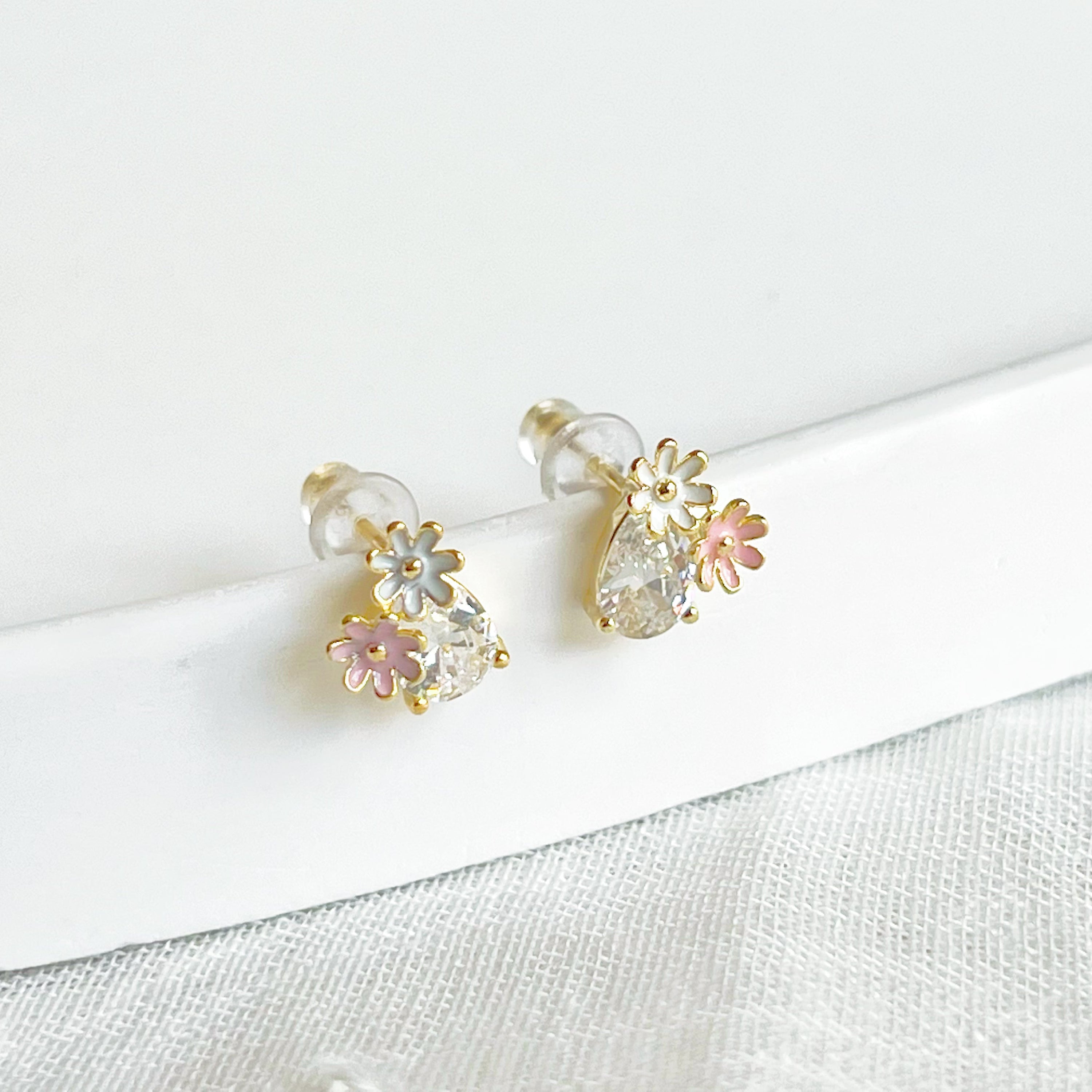 Dainty Daisy Flower Stud Earrings featuring a clear teardrop zircon crystal, crafted from sterling silver and gold plated bronze.