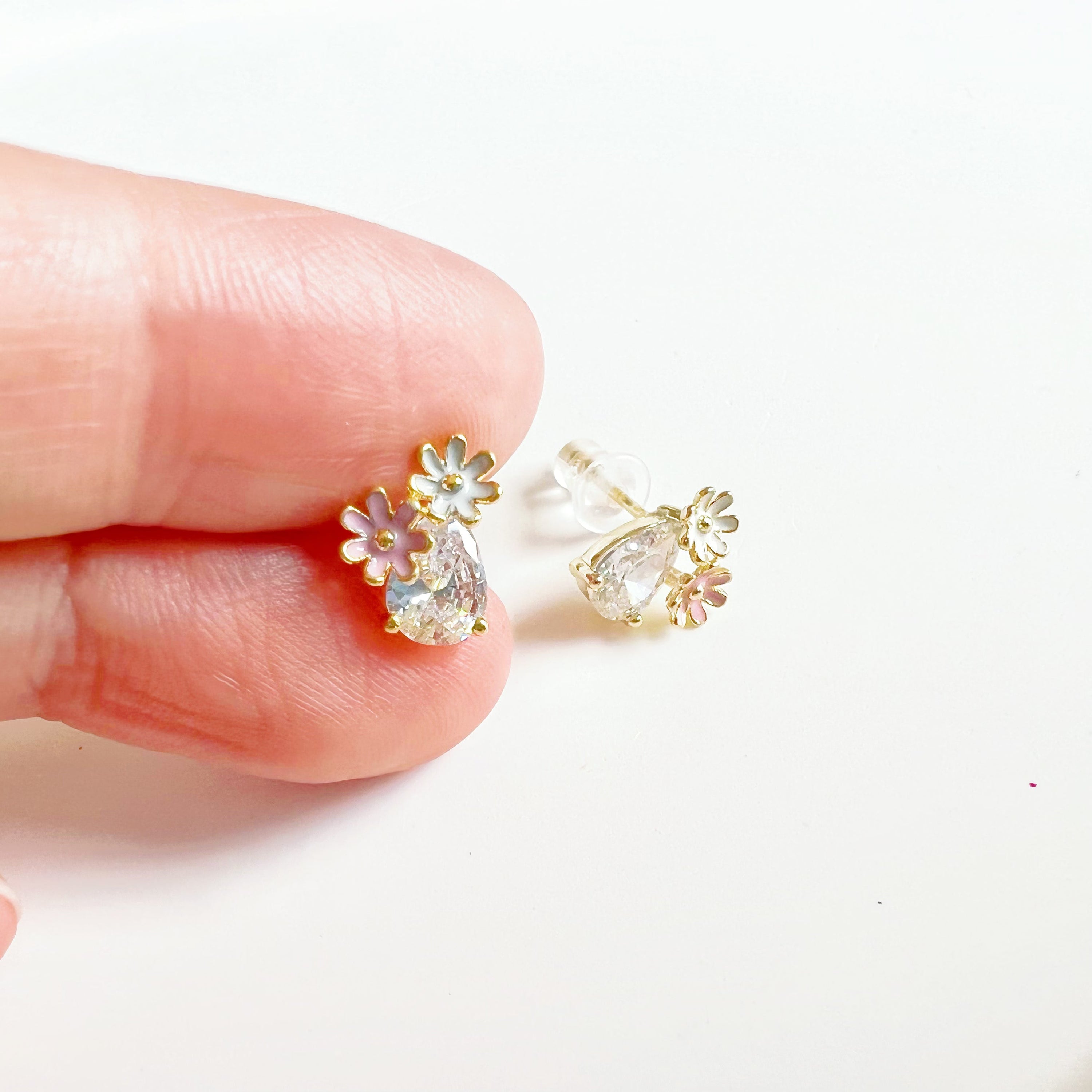 Dainty Daisy Flower Stud Earrings featuring a clear teardrop zircon crystal, crafted from sterling silver and gold plated bronze.