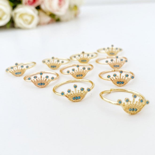 Dainty Evil Eye Ring in rose gold, featuring an adjustable design and a crown evil eye motif, perfect for everyday wear.