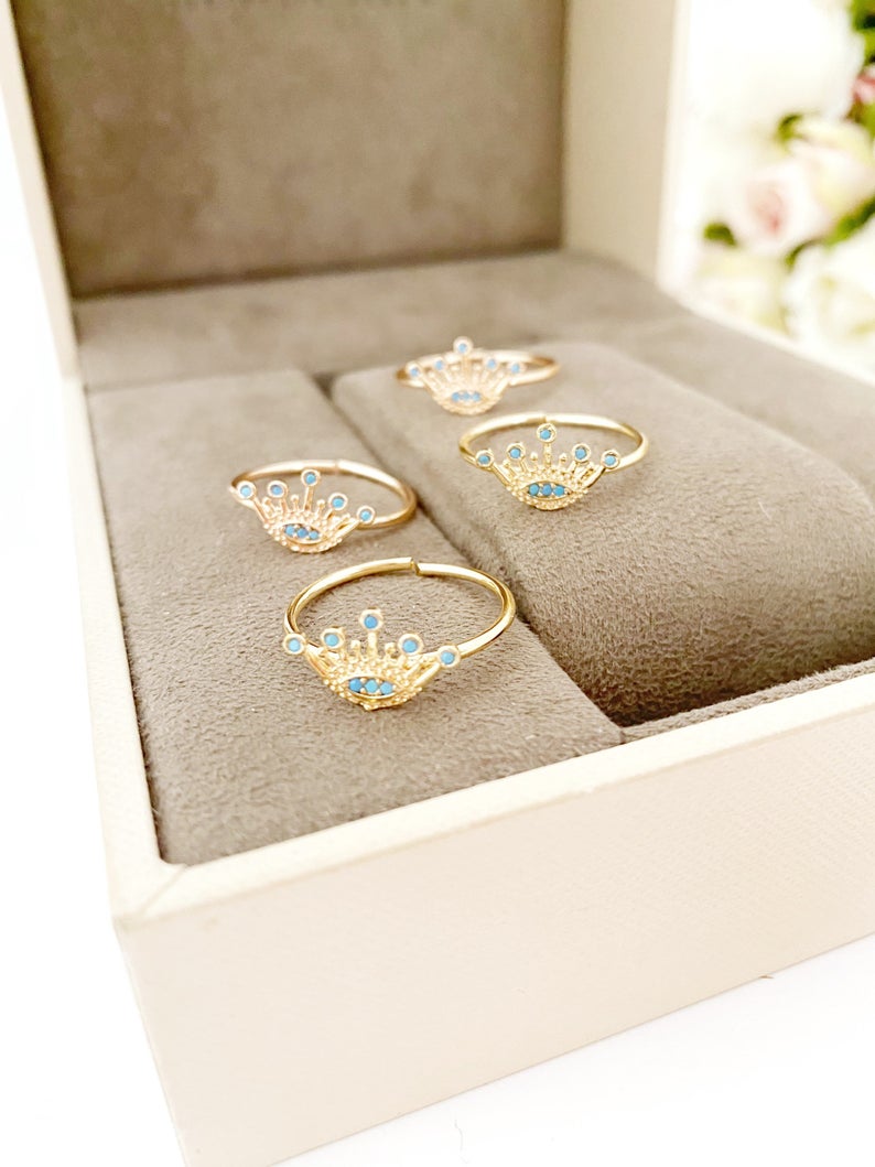 Dainty Evil Eye Ring in rose gold, featuring an adjustable design and a crown evil eye motif, perfect for everyday wear.