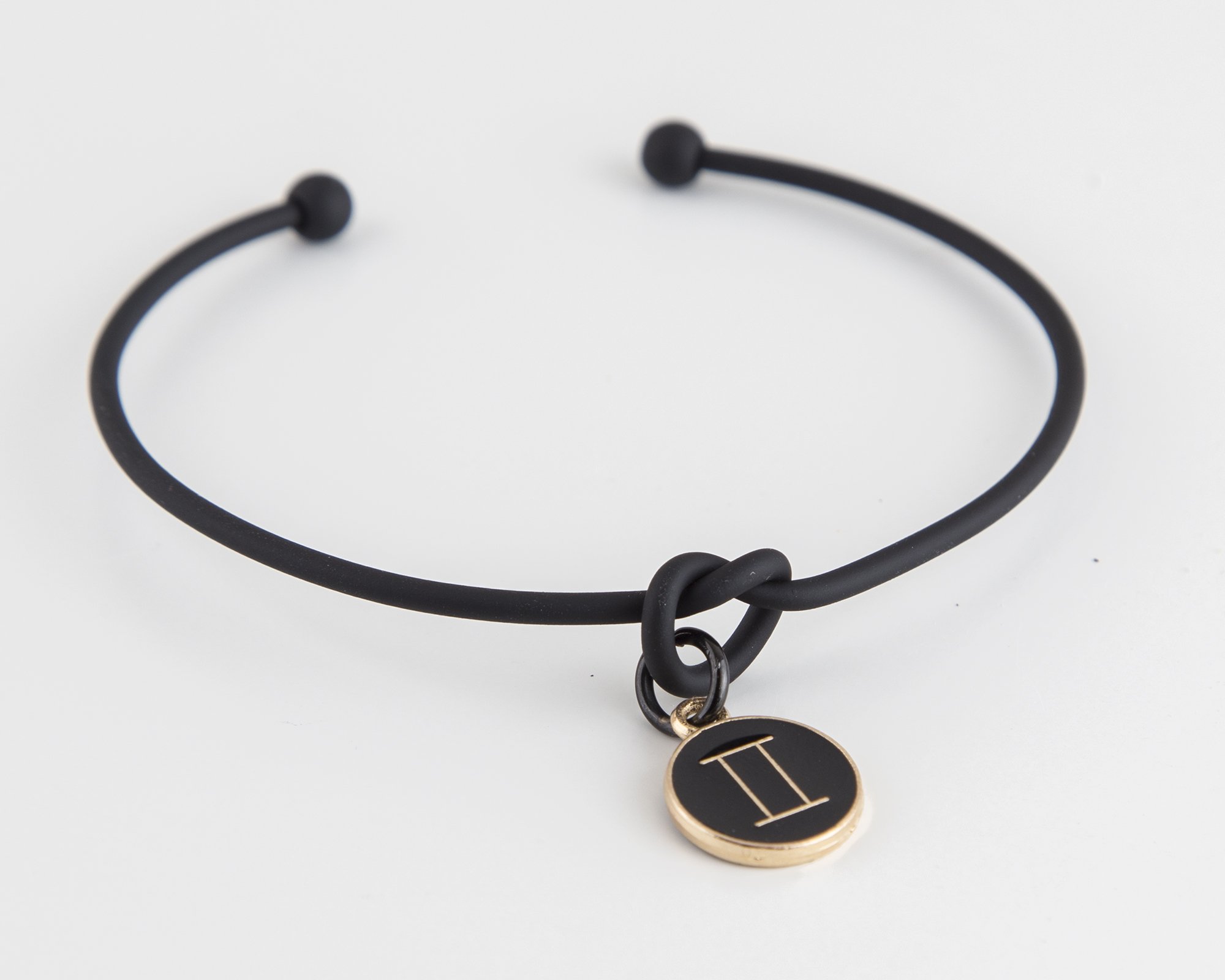 Dainty Knot Bracelet featuring a black metal wire knot design and a zodiac symbol charm, adjustable size for a perfect fit.