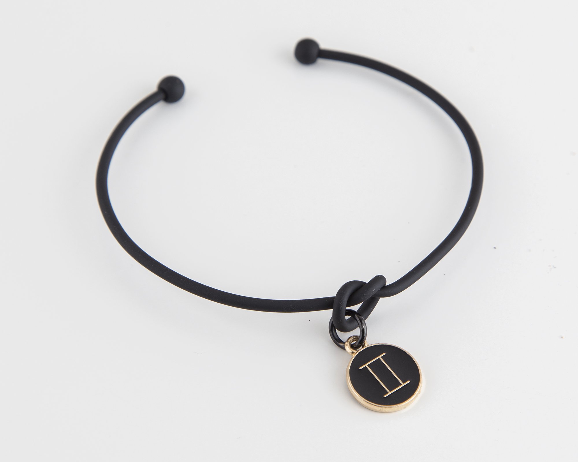 Dainty Knot Bracelet featuring a black metal wire knot design and a zodiac symbol charm, adjustable size for a perfect fit.