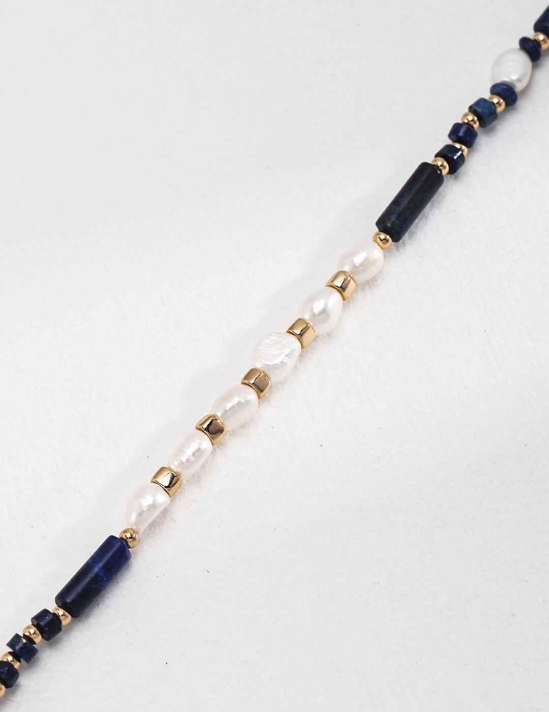 A delicate Dainty Lapis Lazuli Beaded with Pearl Necklace featuring gold vermeil accents, showcasing its elegant design and natural gemstones.