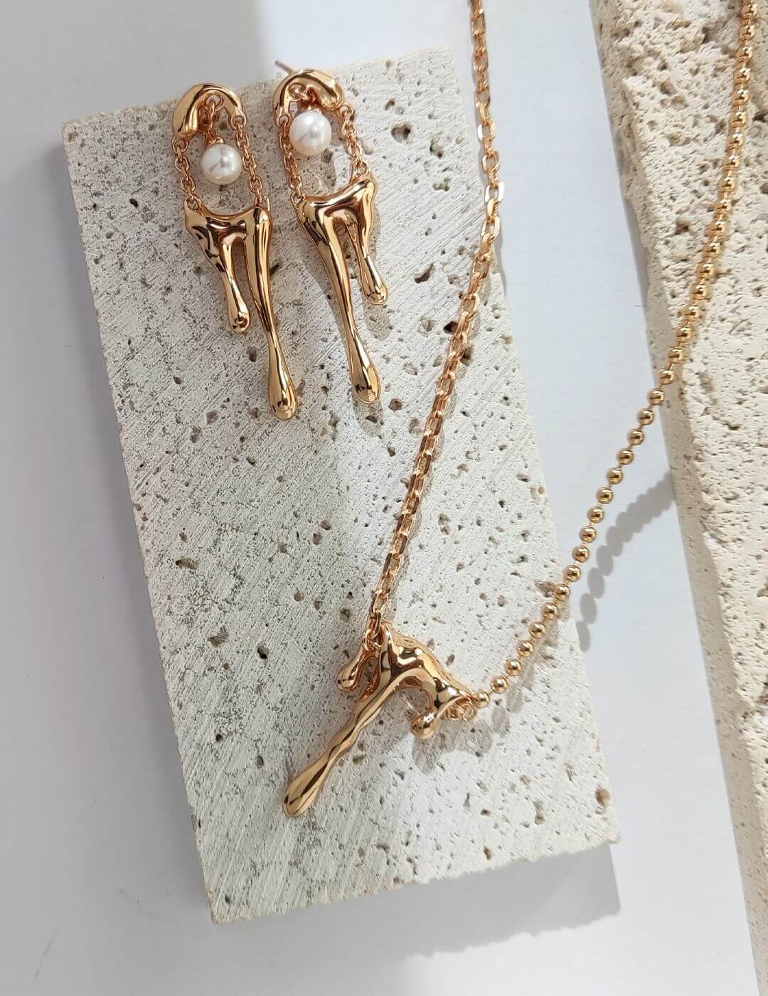 A close-up of the Dainty Lava Style Necklace showcasing its sterling silver and gold vermeil craftsmanship, featuring a delicate pendant.