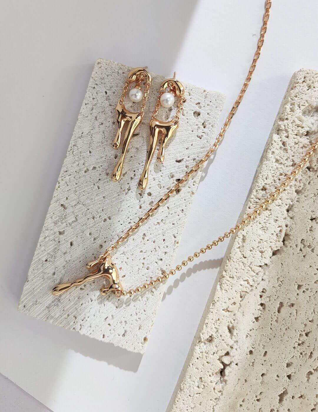 A close-up of the Dainty Lava Style Necklace showcasing its sterling silver and gold vermeil craftsmanship, featuring a delicate pendant.