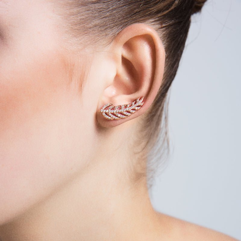 Dainty Silver Feather Ear Cuffs and Climber Earrings featuring intricate feather design and sparkling CZ crystals.