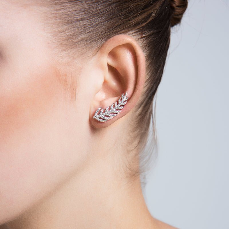 Dainty Silver Feather Ear Cuffs and Climber Earrings featuring intricate feather design and sparkling CZ crystals.