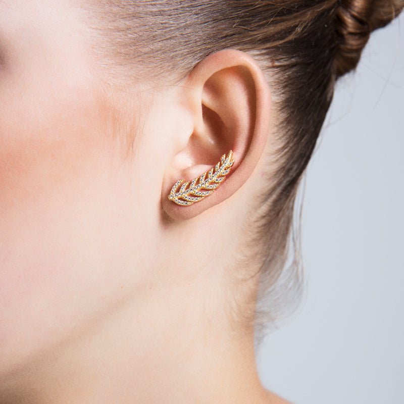 Dainty Silver Feather Ear Cuffs and Climber Earrings featuring intricate feather design and sparkling CZ crystals.