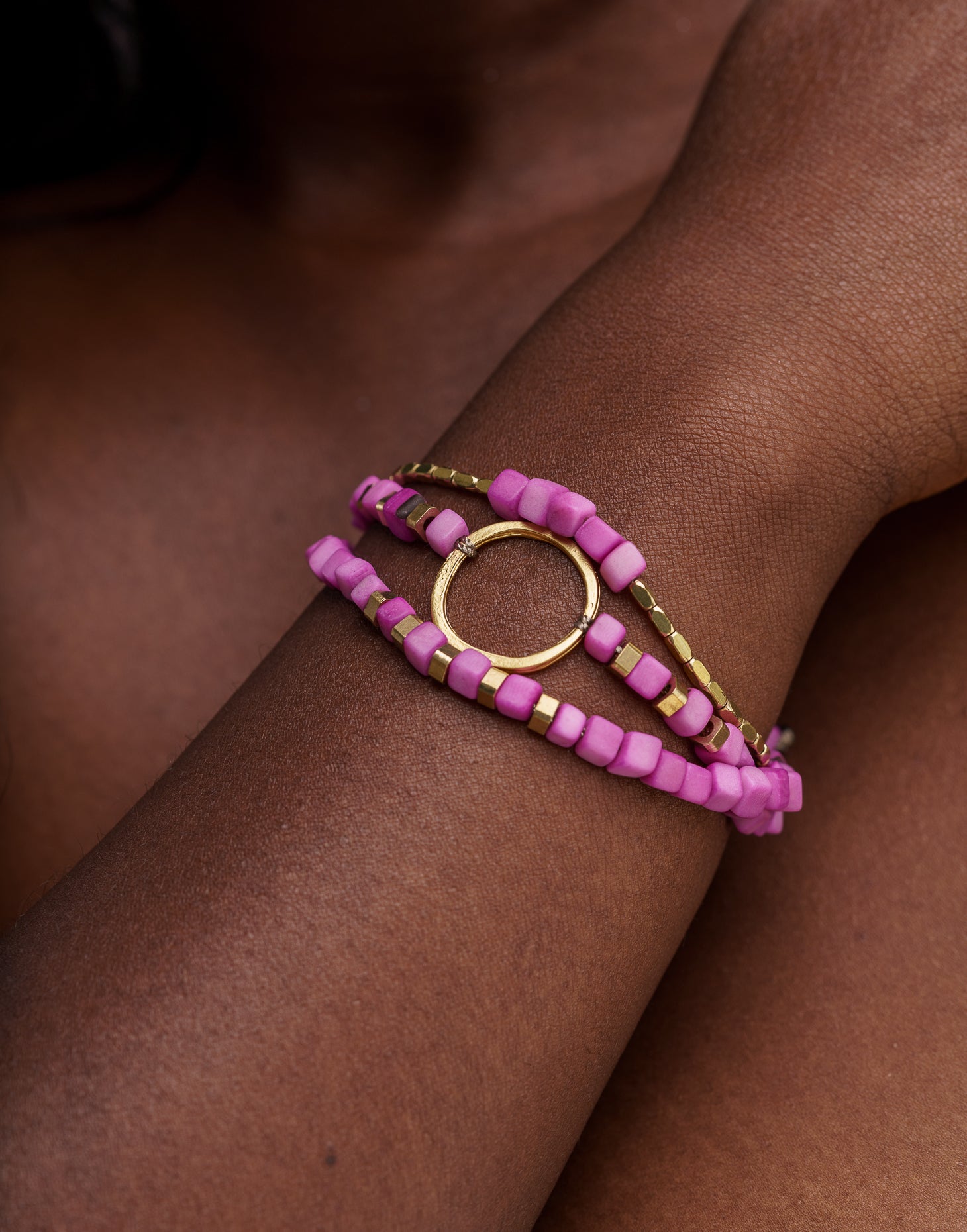 Dainty Triple Tagua Bracelet in pink, featuring delicate tagua nut squares and brass accents, elegantly displayed.