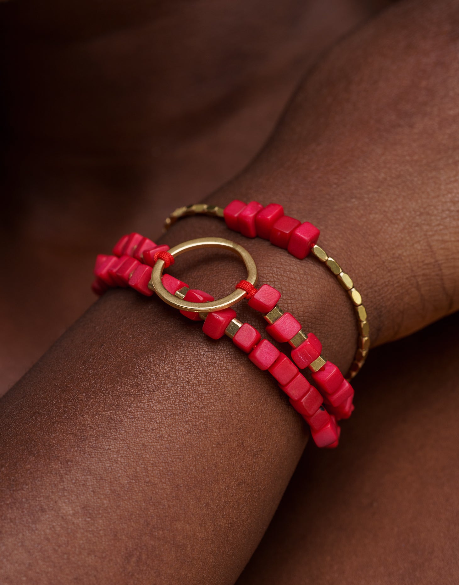 Dainty Triple Tagua Bracelet in Red, featuring handcrafted tagua nut squares and brass accents, displayed elegantly.