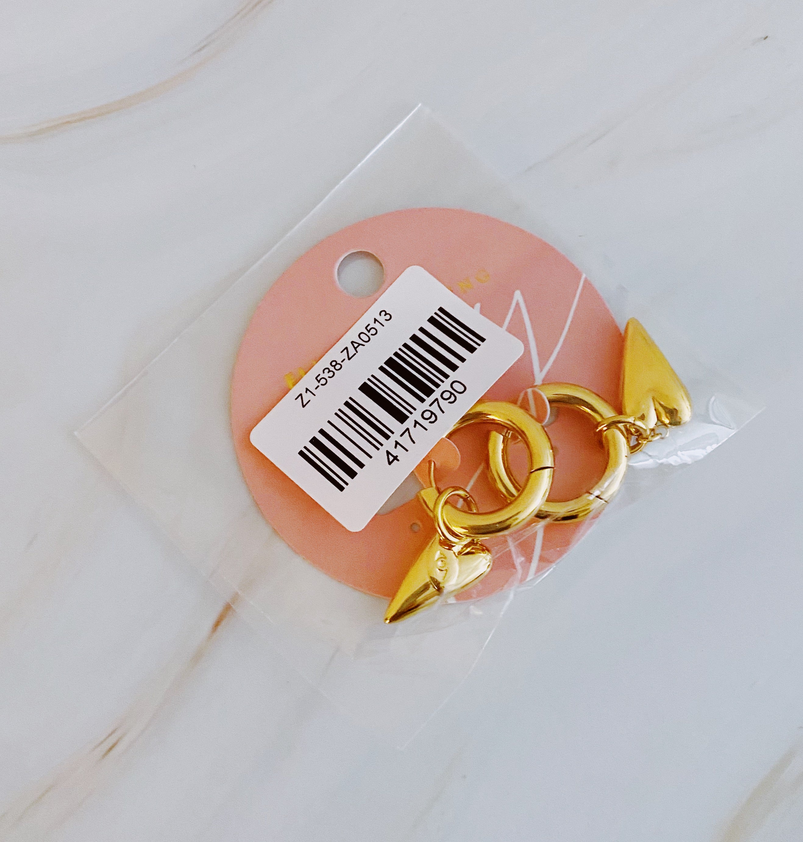 Elegant Dangle Heart Drop Earrings in 18k gold plated stainless steel with intricate design.