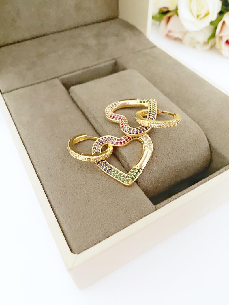 A pair of handmade gold dangle heart earrings featuring rainbow zircon, perfect for Valentine's Day and weddings.