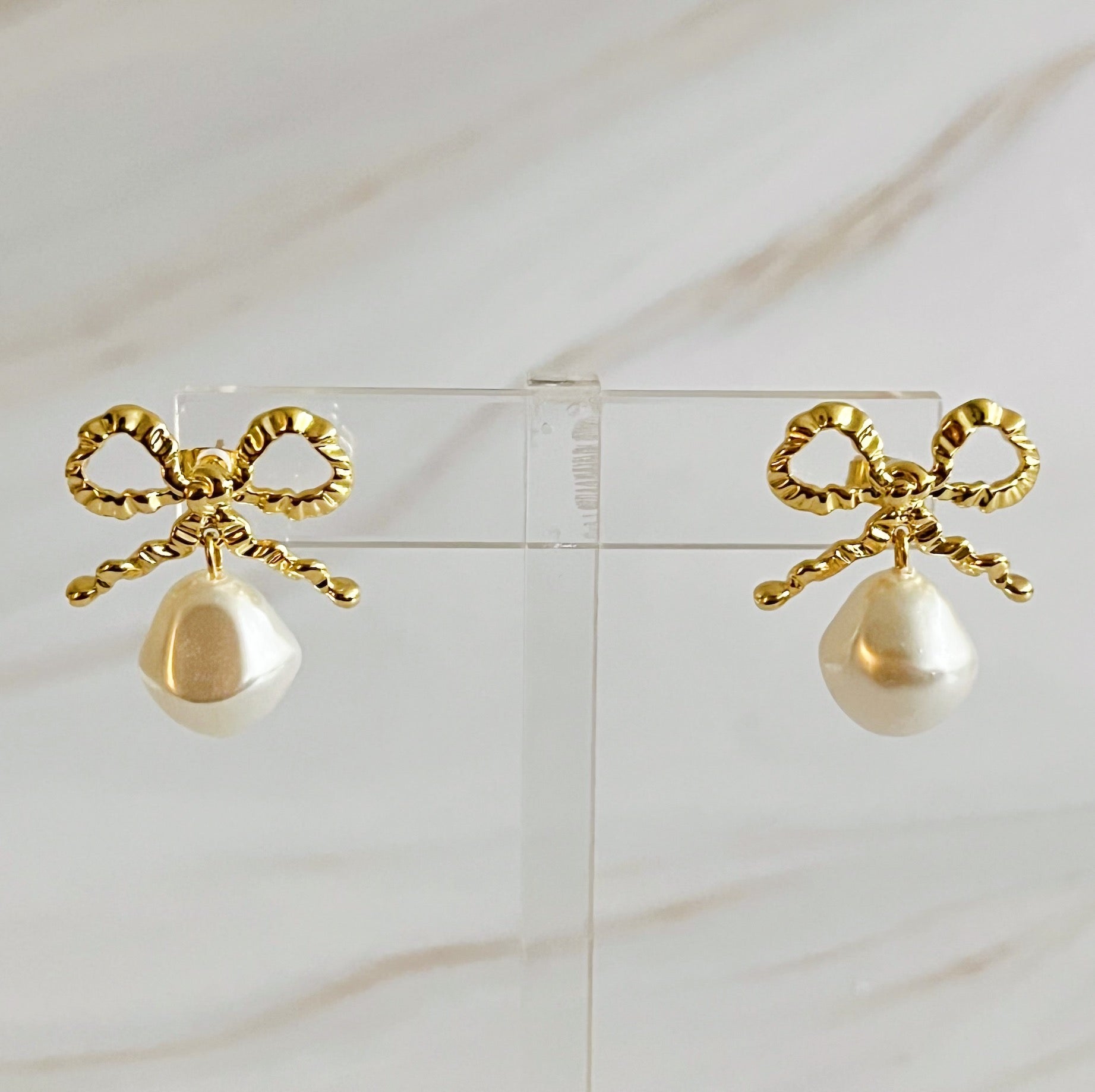 Elegant Dangle Pearl Antique Bow Earrings featuring a crinkled antique bow and a dangling glass pearl, perfect for sophisticated styling.