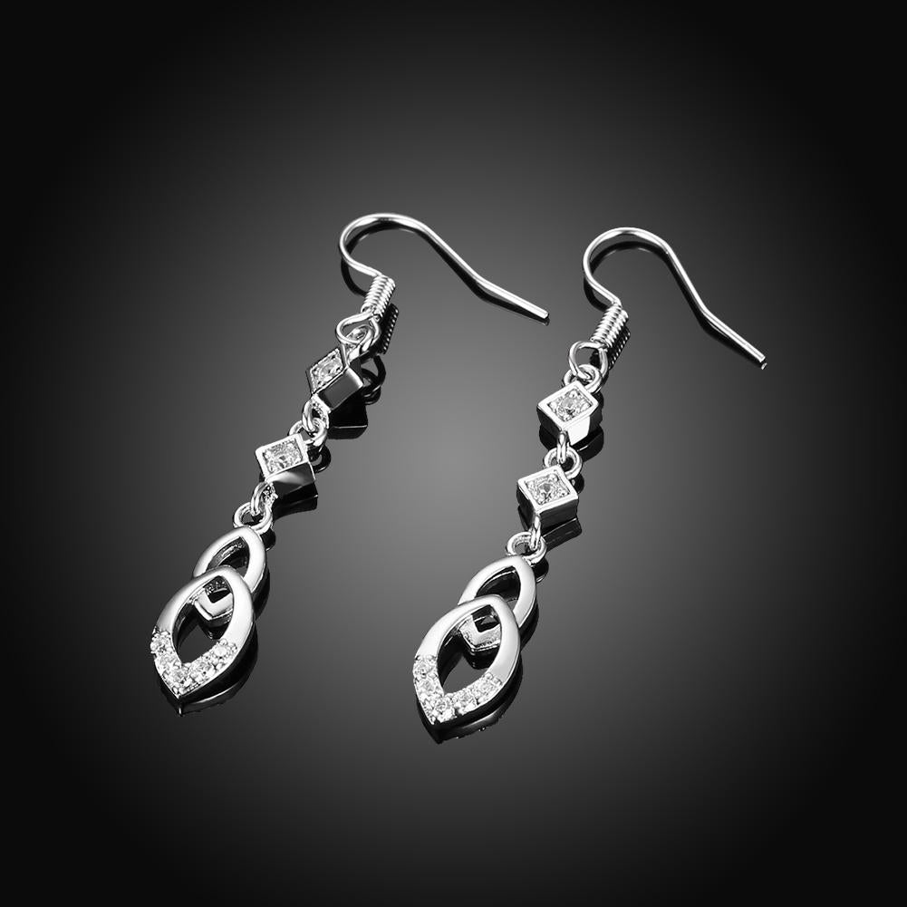 Elegant dangling infinity drop earrings made with certified crystals and 18K white gold plating, showcasing a sophisticated design.