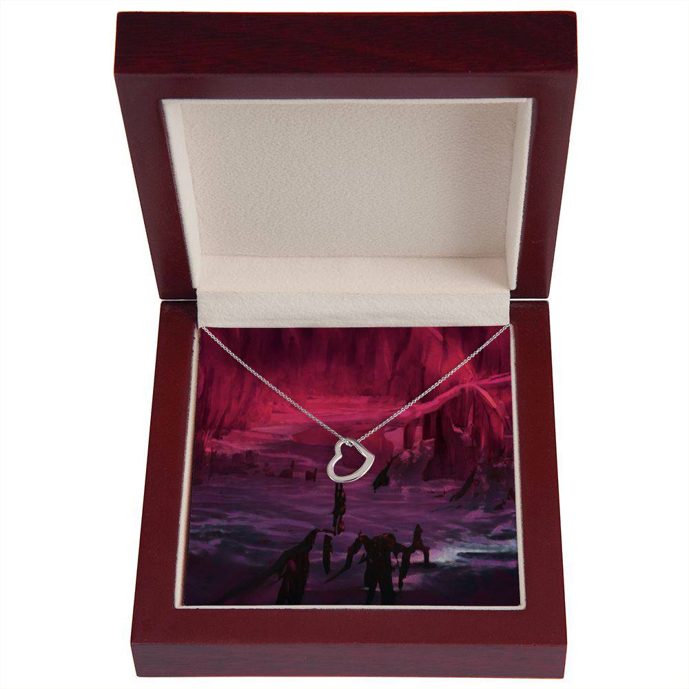 Delicate Heart Necklace in sterling silver with gold dip, showcasing its elegant heart pendant and adjustable chain.