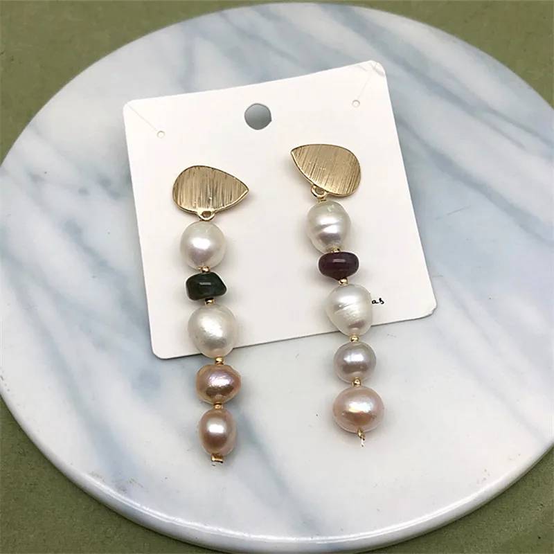 Elegant designer dangle earrings featuring genuine freshwater white and pink pearls with gold accents, showcasing a unique and stylish design.