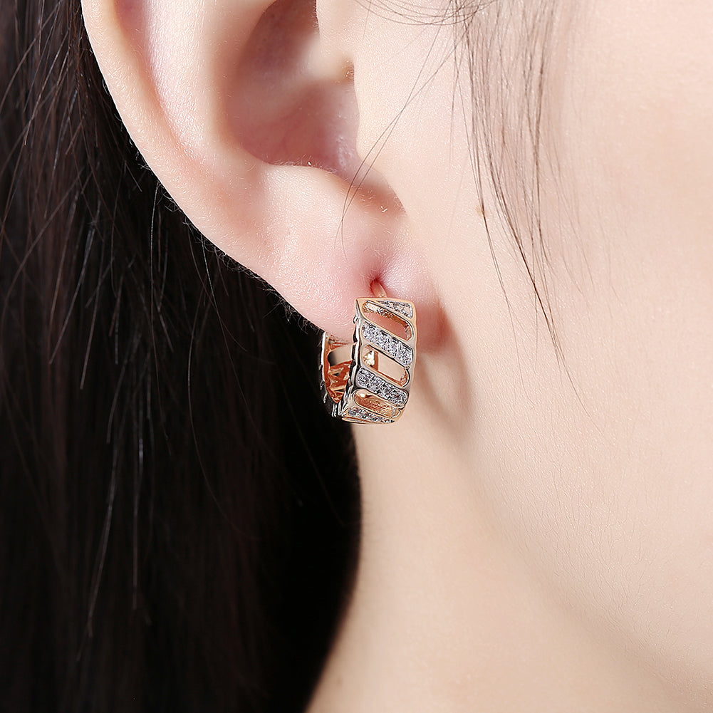 Elegant Diamond Cut Opening Huggie Earring in 18K Gold Plated, showcasing its unique design and luxurious finish.