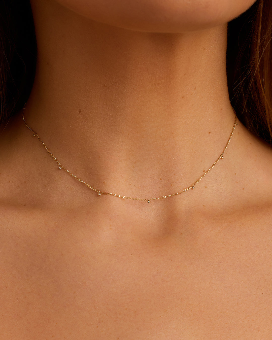 A close-up view of the Diamond Dot Flutter Choker showcasing its intricate diamond dot design and elegant appearance.