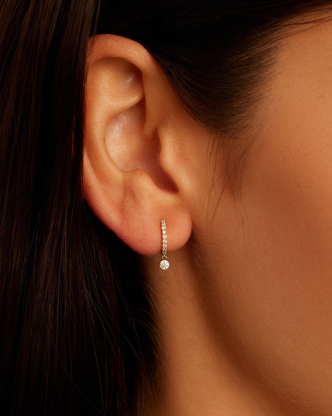 Elegant Diamond Drop Pavé Huggies featuring sparkling diamonds in a delicate pavé setting, perfect for any occasion.