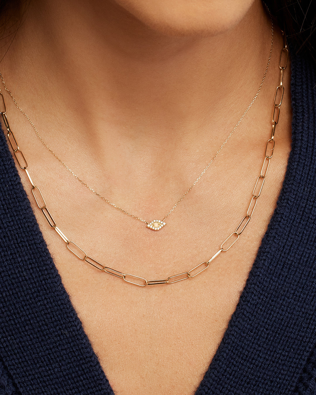 A beautiful Diamond Evil Eye Necklace featuring sparkling diamonds in an intricate evil eye design, symbolizing protection and elegance.