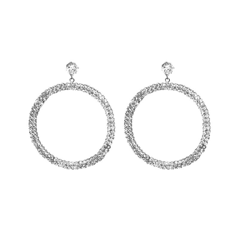 A pair of elegant diamond hoop earrings featuring sparkling rhinestones and 925 silver accents, showcasing a timeless design.