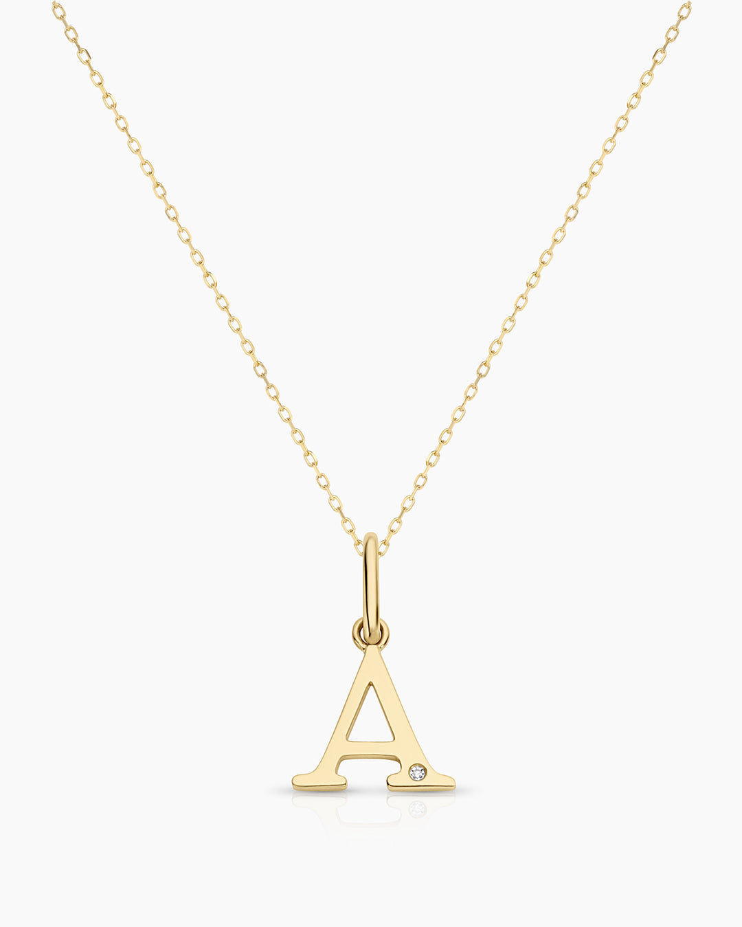 Diamond Vintage 18K Alphabet Charm Necklace featuring a sparkling diamond-encrusted charm on a delicate gold chain.