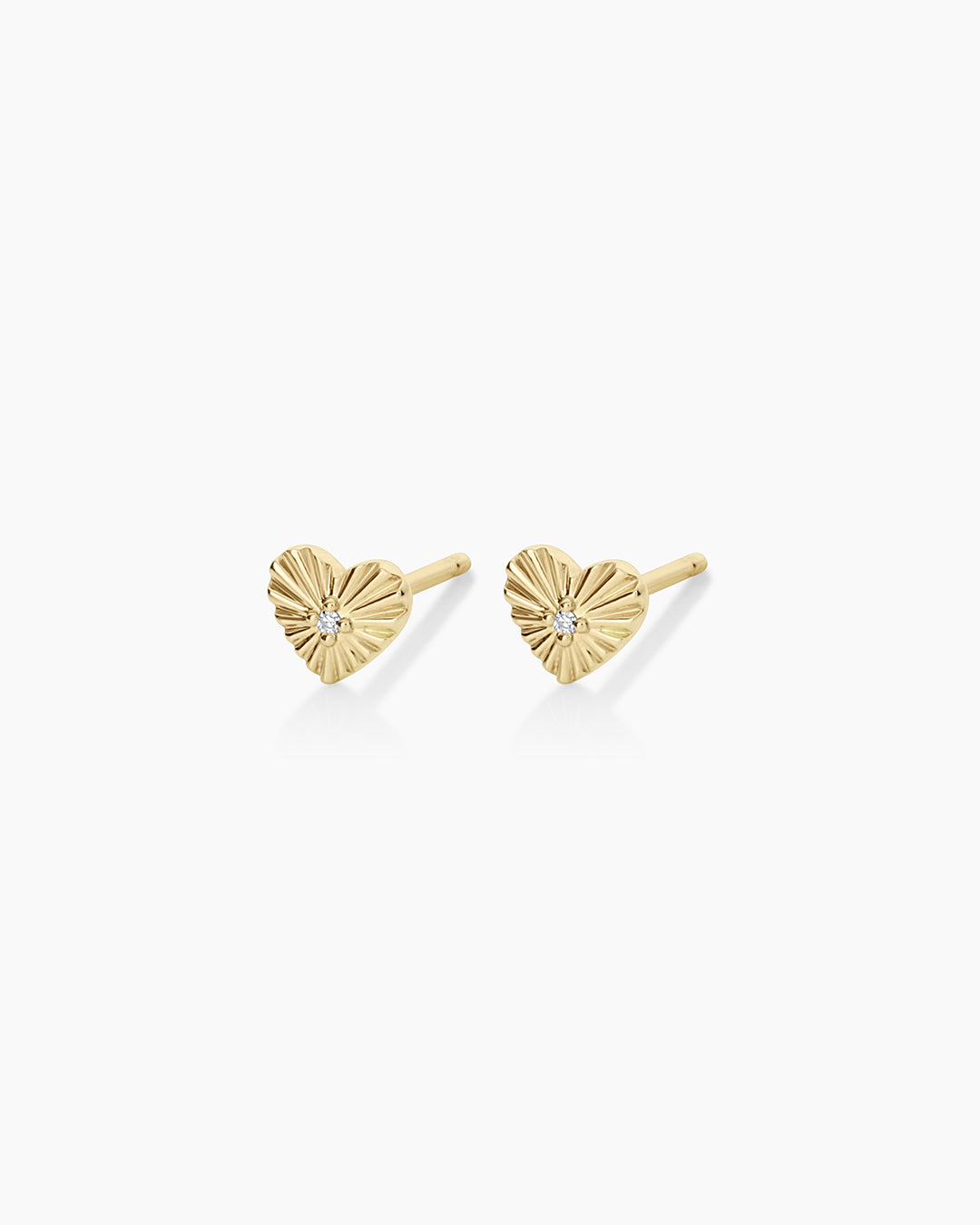 A pair of elegant vintage heart-shaped diamond studs, showcasing sparkling lab-grown diamonds set in a classic design.