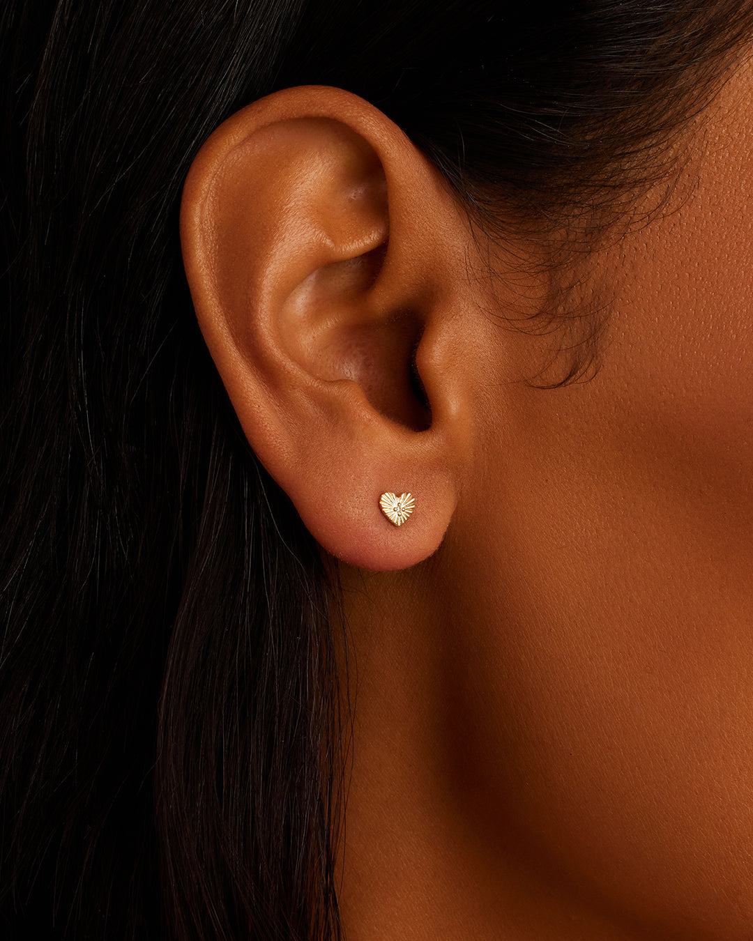 A pair of elegant vintage heart-shaped diamond studs, showcasing sparkling lab-grown diamonds set in a classic design.