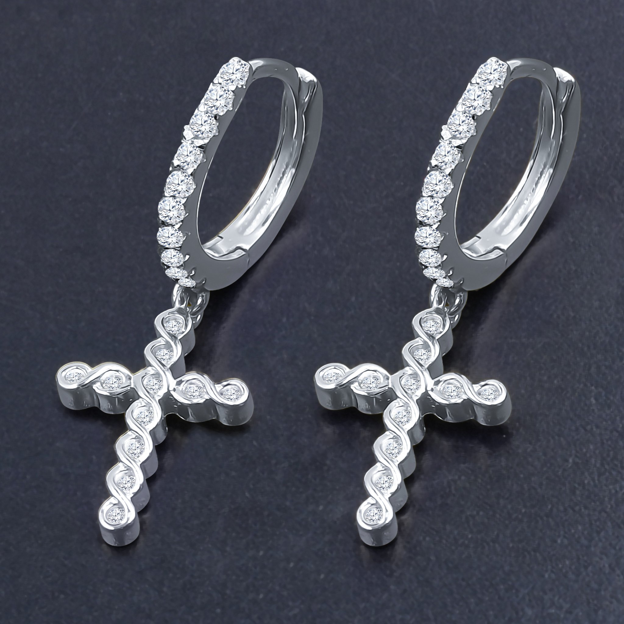 DOMINIQUE Silver Earrings featuring a hoop design with cubic zirconia stones and a cross symbol, elegantly crafted from 925 sterling silver.
