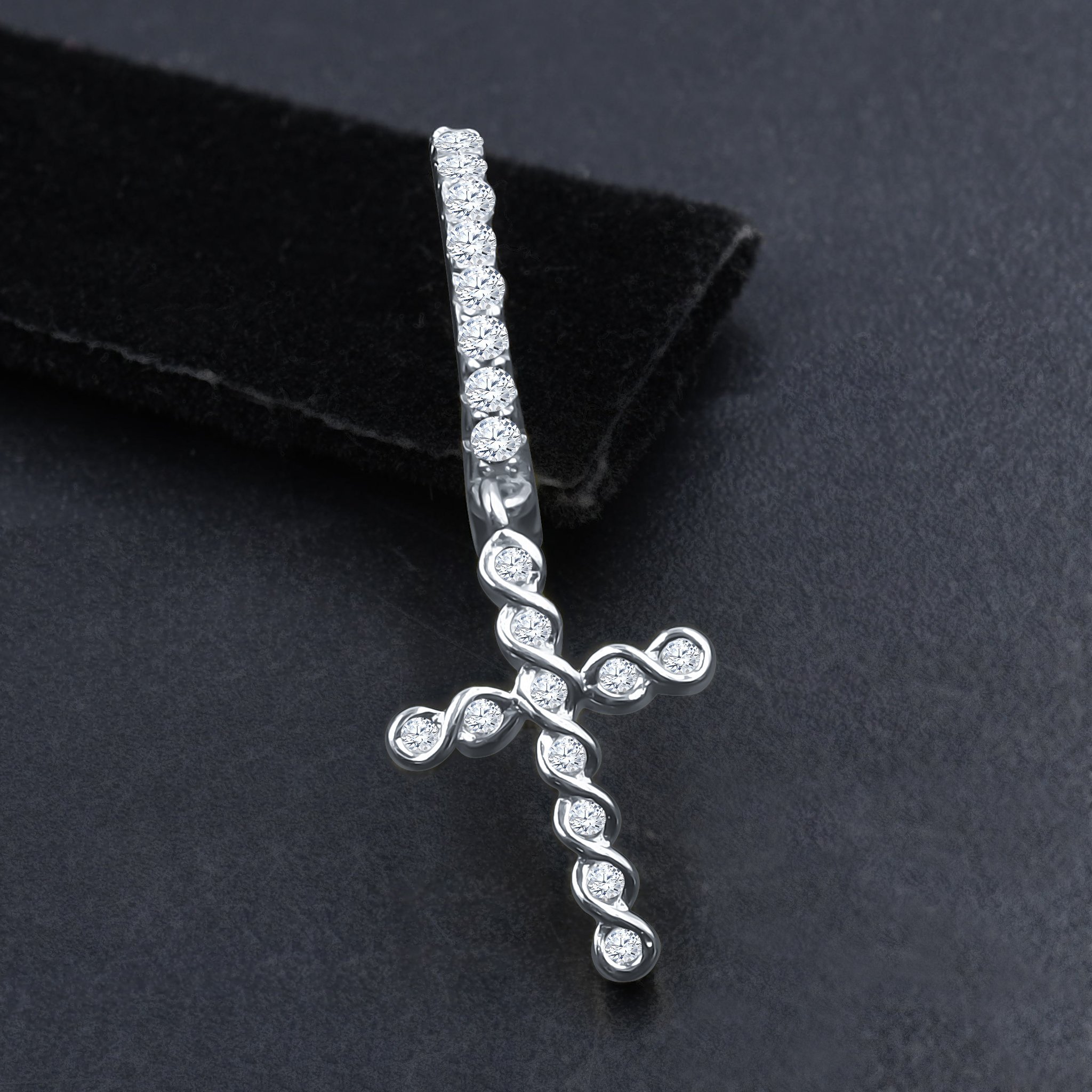 DOMINIQUE Silver Earrings featuring a hoop design with cubic zirconia stones and a cross symbol, elegantly crafted from 925 sterling silver.